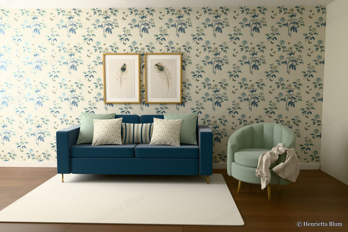 Room with chrysanthemum wallpaper, an indigo sofa, a sage armchair and peacock-feather prints